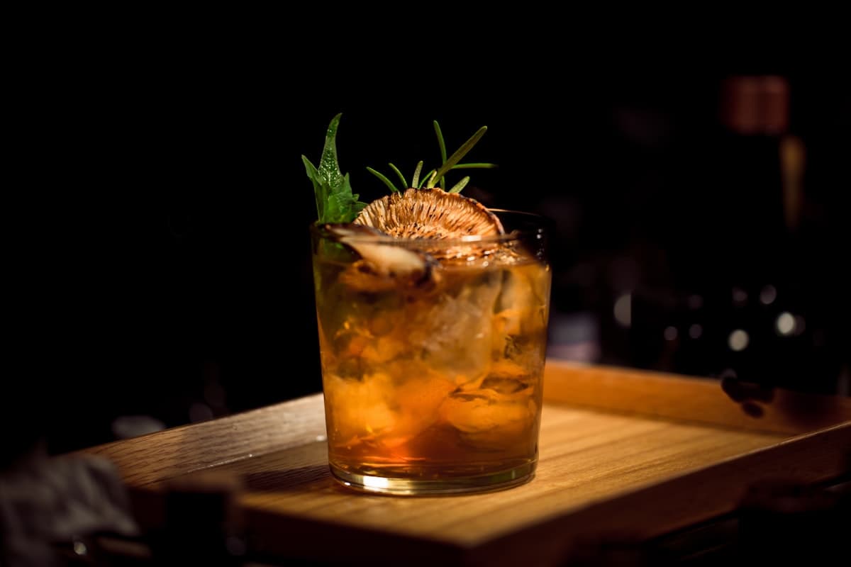 Craft cocktails with neon-lit Miami nightlife backdrop