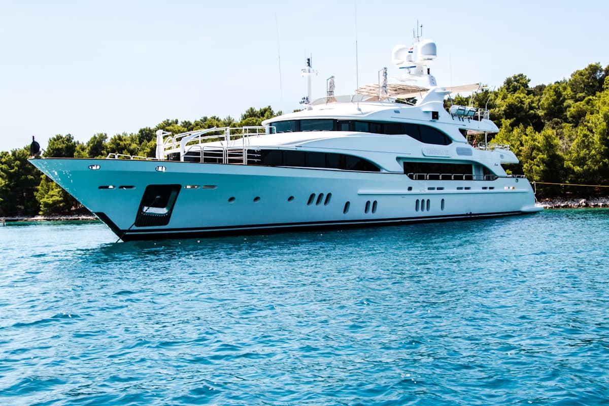 Luxury yacht cruising through Biscayne Bay with Miami skyline